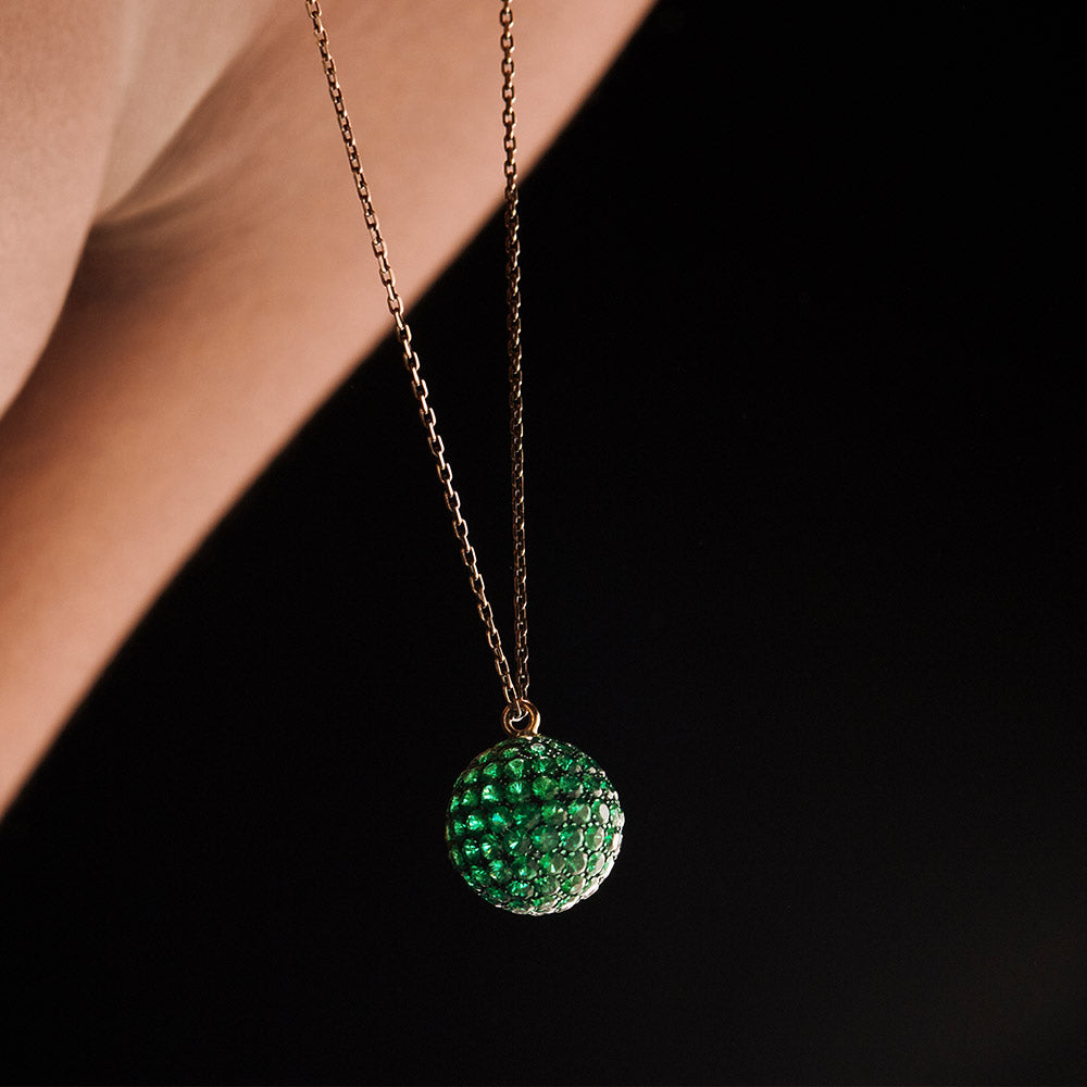 Emerald Mirror ball necklace hanging in motion from neck by Solange Azagury-Partridge