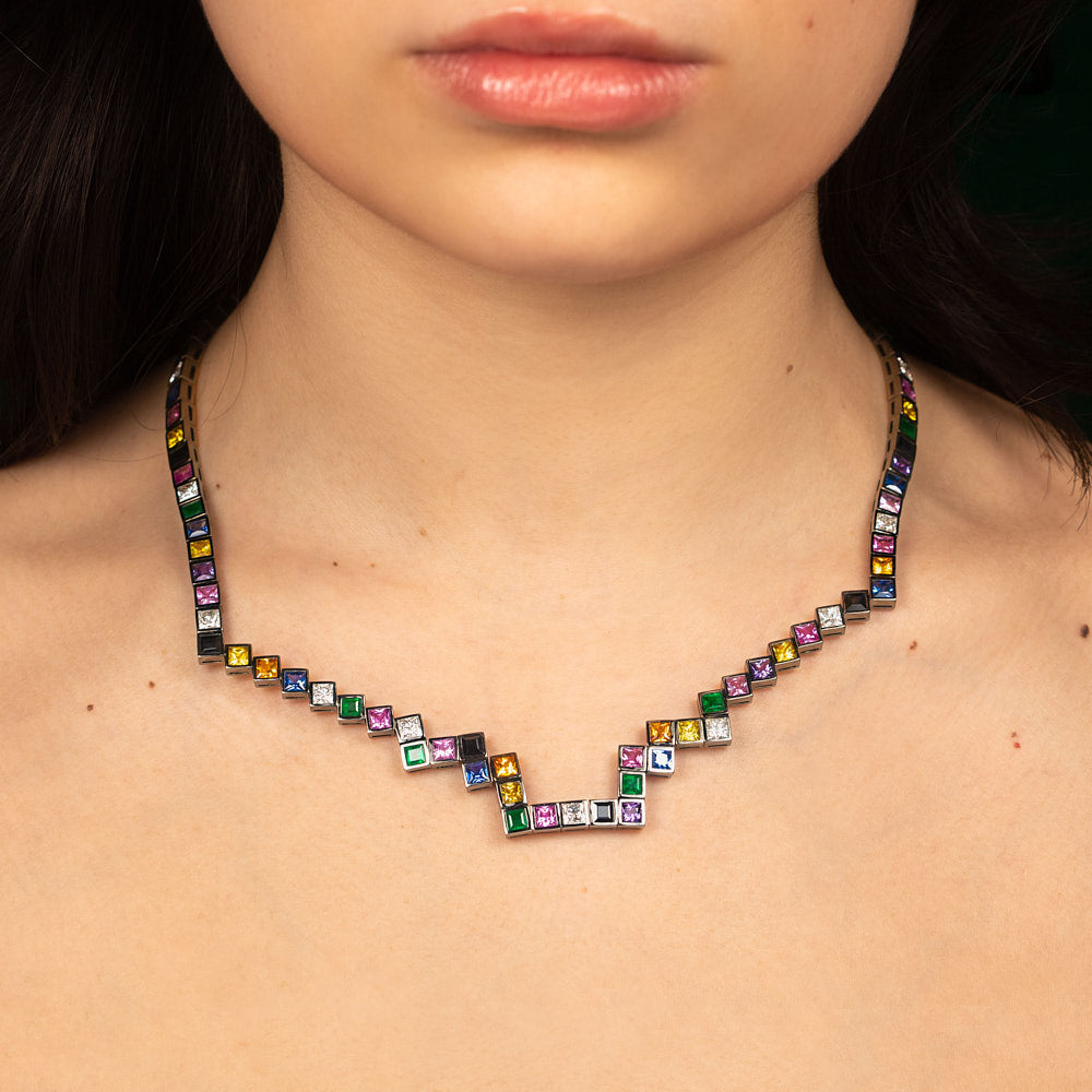 A random layout of square and princess cut Diamonds, coloured Sapphires, Rubies and Emeralds skinny necklace in blackened 18 karat white gold by Solange Azagury-Partridge On Model Front