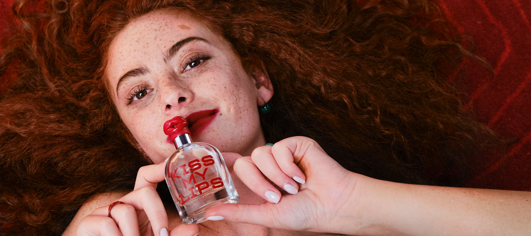 Kiss My Lips Perfume Campaign on Red Rug