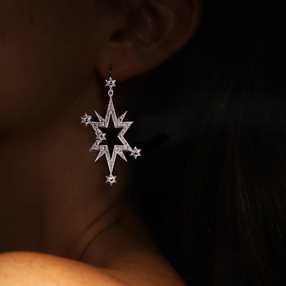 Aster Earrings by designer Solange Azagury-Partridge - 18k White Gold, star cut and rose cut diamonds - front view on model