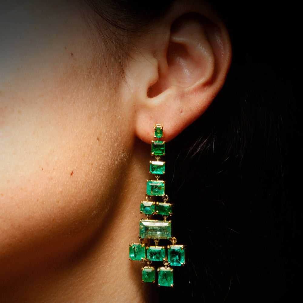 The Misfits Earrings by designer Solange Azagury-Partridge - YG and Emeralds - front view on model