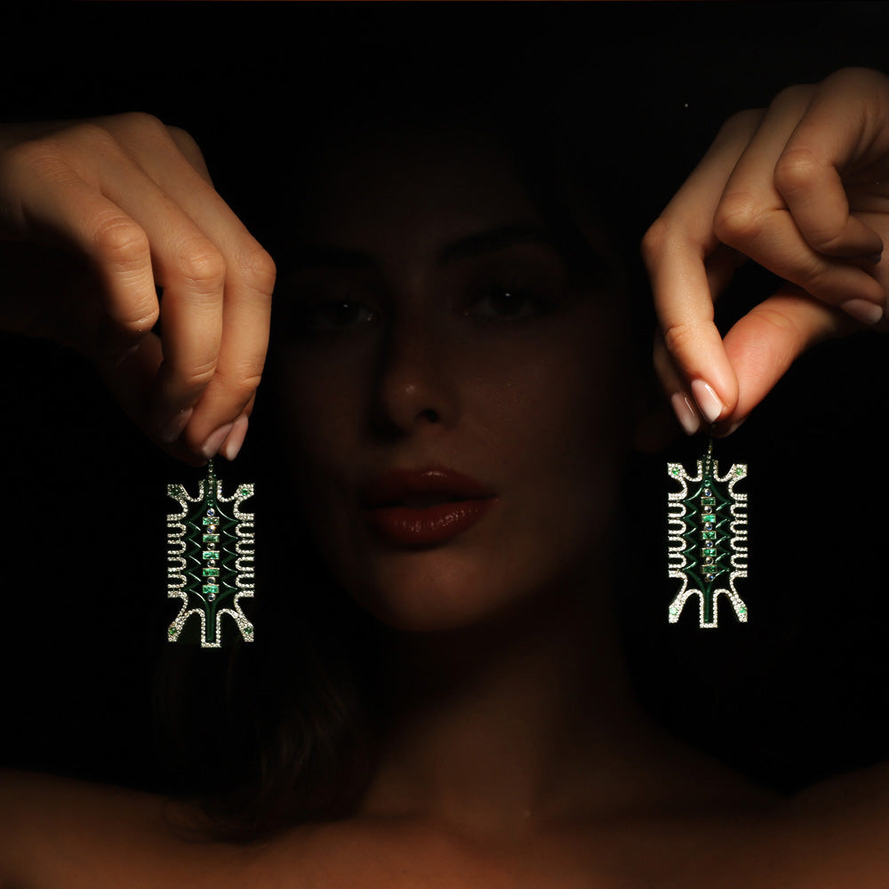 The Sistine Earrings by designer Solange Azagury-Partridge - 18 carat Blackened White Gold and 18 carat Blackened Yellow Gold, emerald, sapphire, diamond, green ceramic and enamel - model styling 2