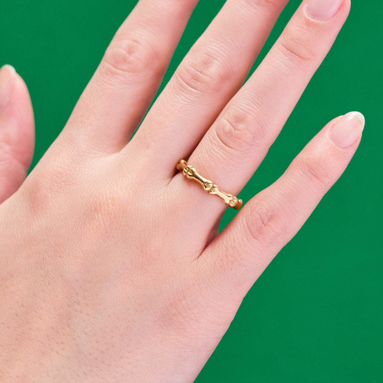 Bones Motif Wedding Band Ring made from 18 karat yellow gold by Solanage Azagury-Partridge on hand