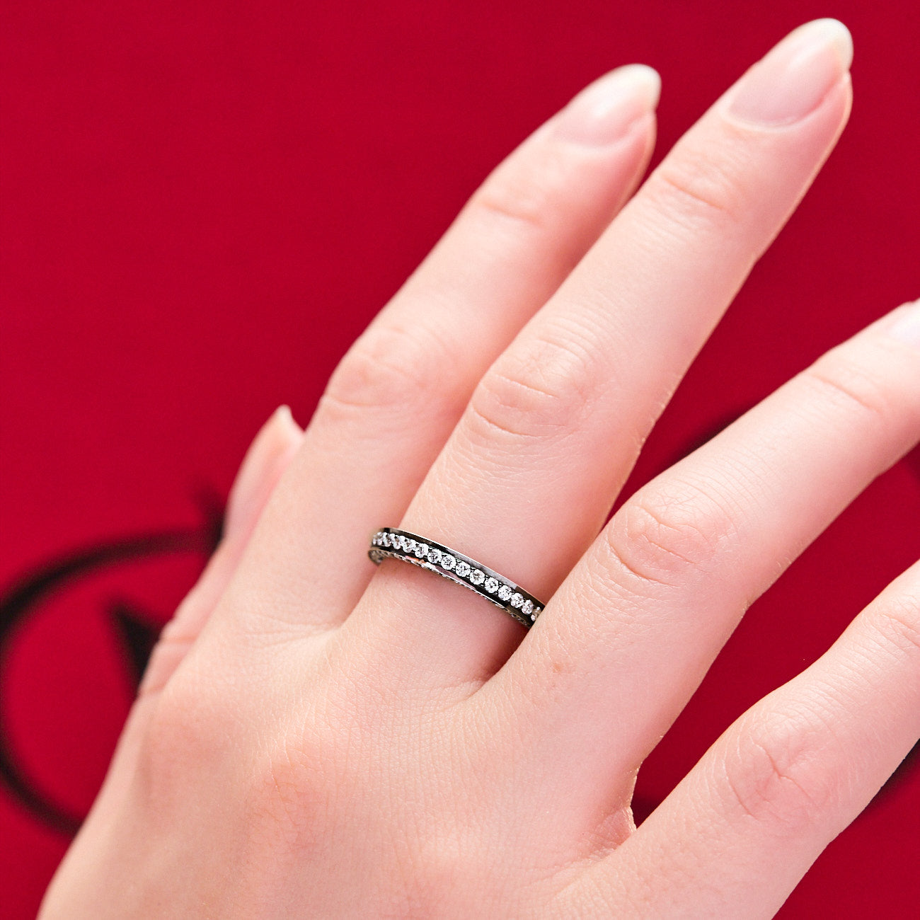 Cinderella Ring Eternity band with diamonds on three sizes diamonds and blackened 18 karat white gold by Solange Azagury-Partridge on hand