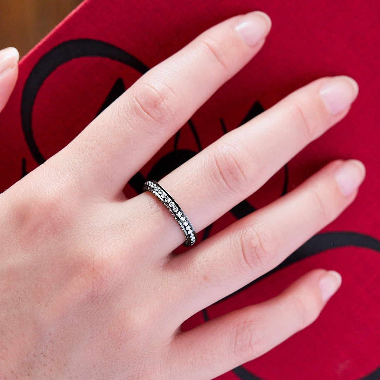 Cinderella Ring Eternity band with diamonds on three sizes diamonds and blackened 18 karat white gold by Solange Azagury-Partridge on hand