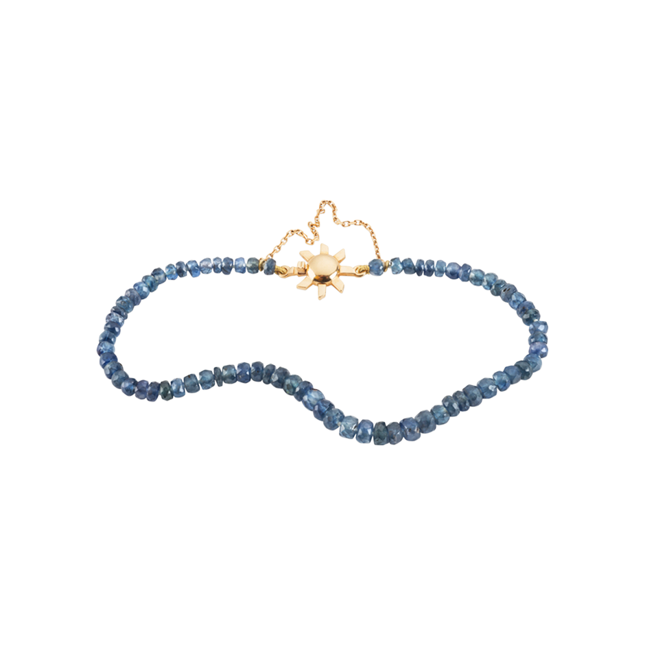 A friendship sapphire beaded bracelet with 18 karat yellow gold sun shaped clasp by Solange Azagury-Partridge