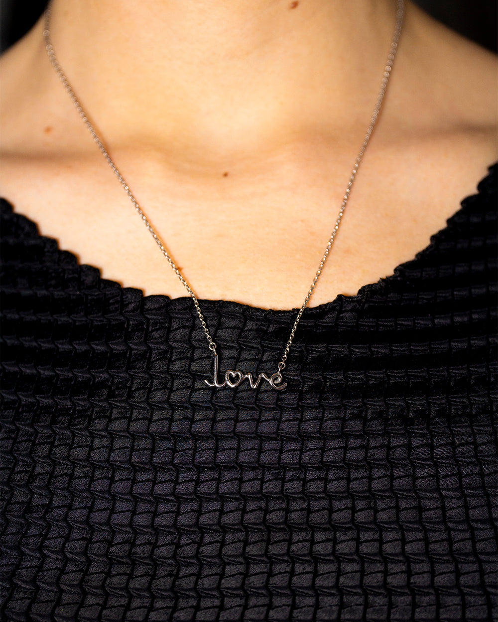 Love Written word pendant necklace 18k white gold by Solange Azagury-Partridge on neck
