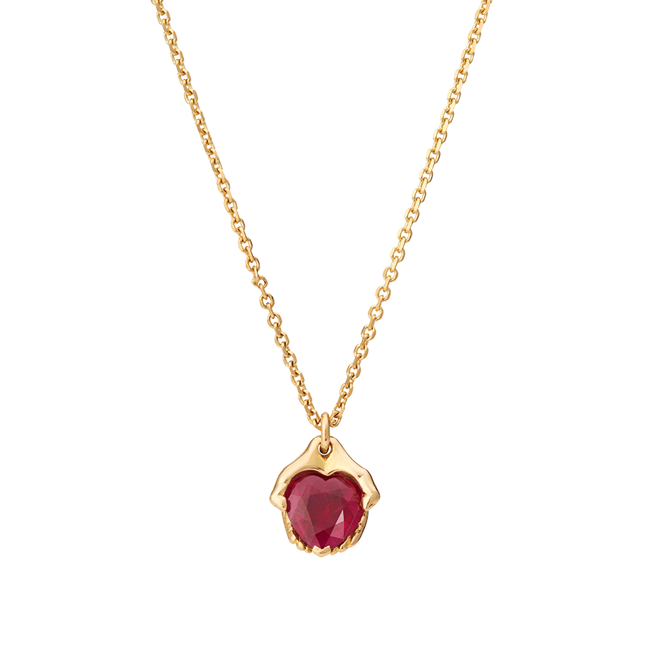 A pendant composed of a ruby gently held within a pair of 18k yellow gold hands by Solange Azagury-Partridge