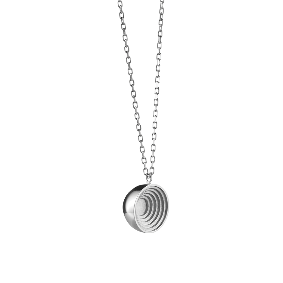 A round engraved motif pendant with chain in 18 karat white gold by Solange Azagury-Partridge