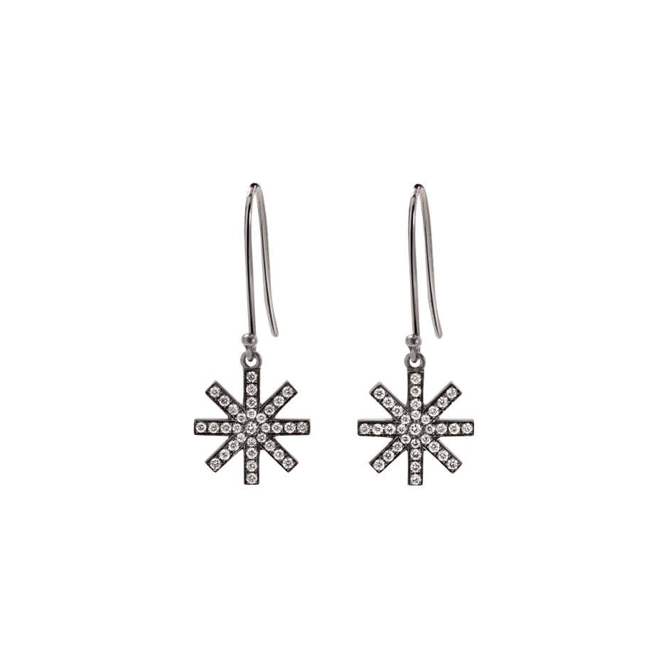A pair of delicate star motif earrings set with brilliant cut diamonds in blackened 18 karat white gold by Solange Azagury-Partridge