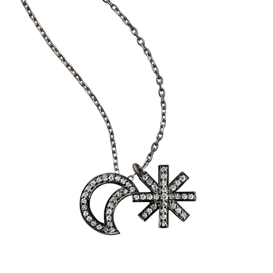 A moon and star motif pendant set with brilliant cut diamonds in blackened 18 karat white gold by Solange Azagury-Partridge