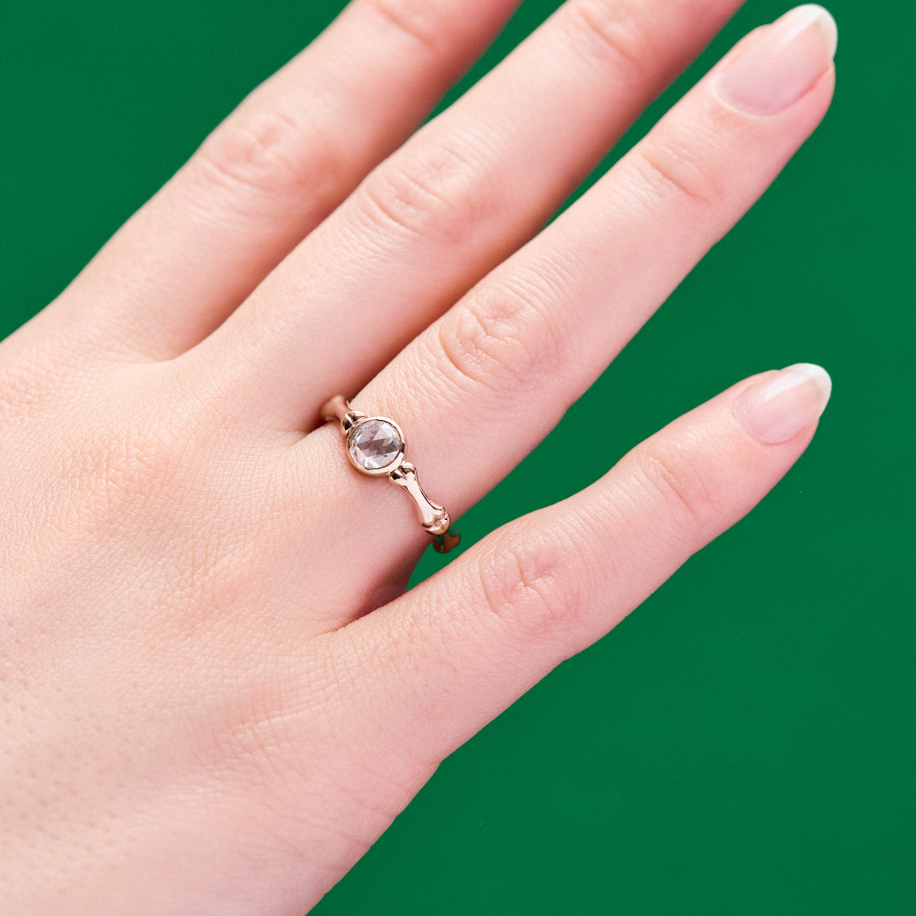 Till Death Us Do Part Bone motif engagement ring with rose cut diamond and 18 karat white gold by Solange Azagury-Partridge on hand