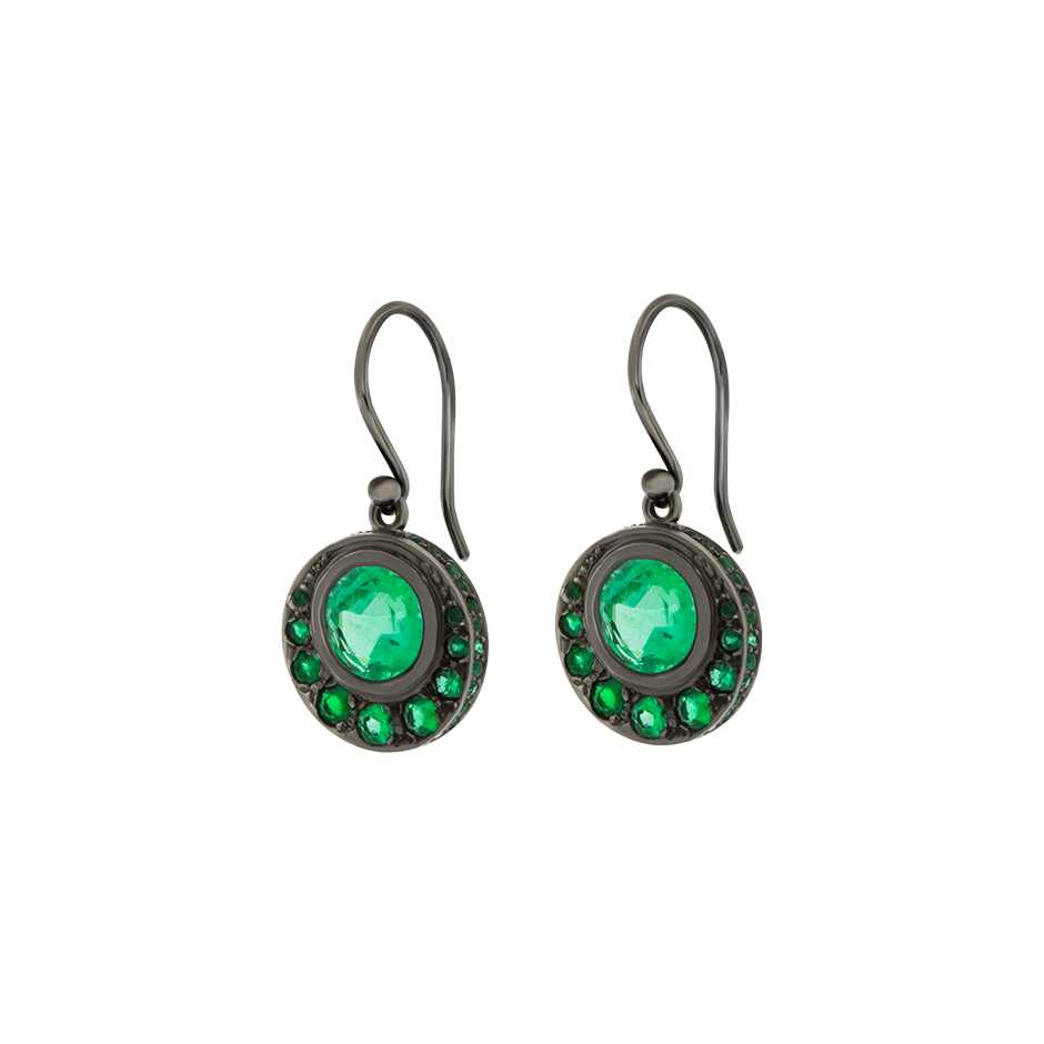 A pair of crescent shaped drop earrings made from emeralds set in 18 karat blackened white gold by Solange Azagury-Partridge