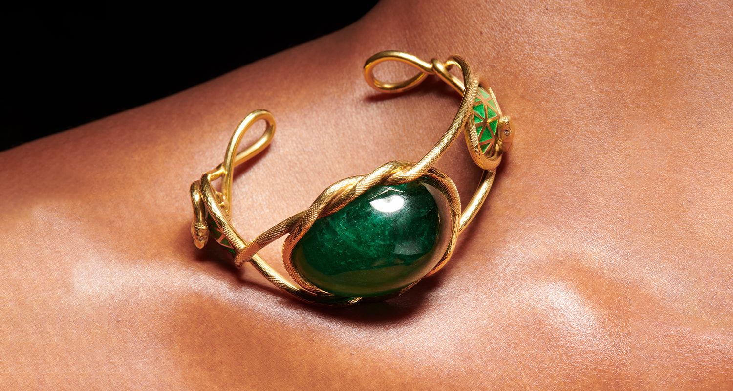 Emerald and 18 karat yellow gold bangle for stoned collection banner by Solange Azagury-Partridge