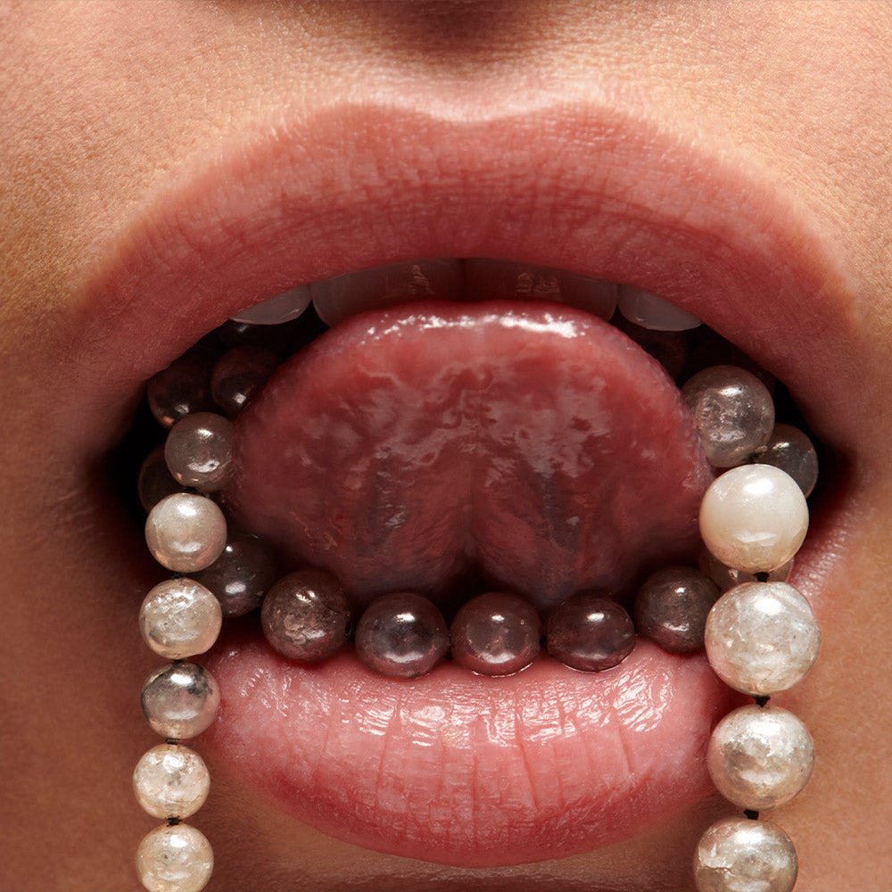 Milkyway Diamond beaded necklace wrapped around tongue in mouth by Solange Azagury-Partridge