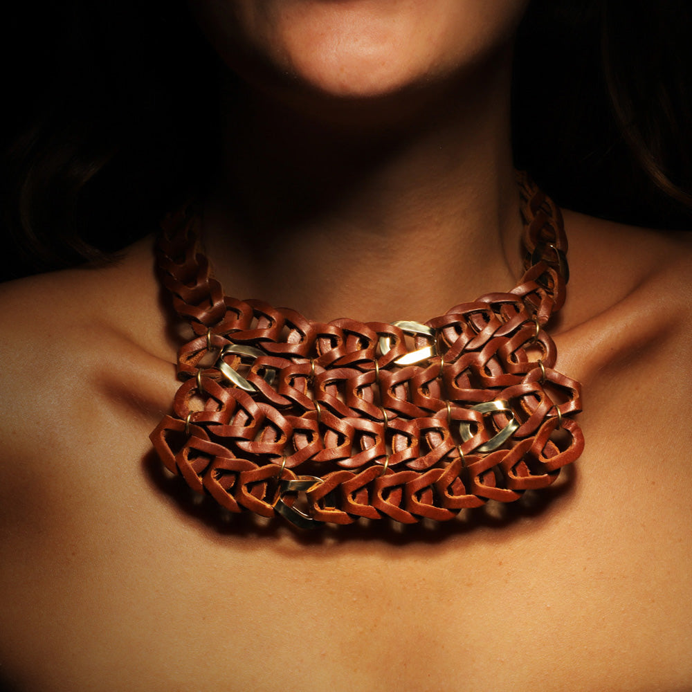 Gladiator necklace by designer Solange Azagury-Partridge - Leather and 18 carat gold - front view on model