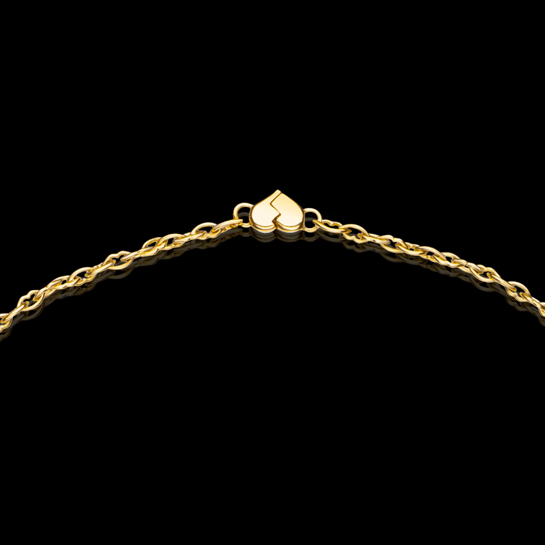 The Love and Kisses chain long necklace by designer Solange Azagury-Partridge - 18 carat Yellow Gold - detail crop