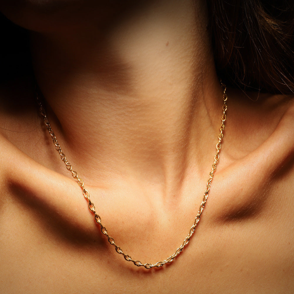 The Love and Kisses chain short necklace by designer Solange Azagury-Partridge - 18 carat Yellow Gold - front view on model
