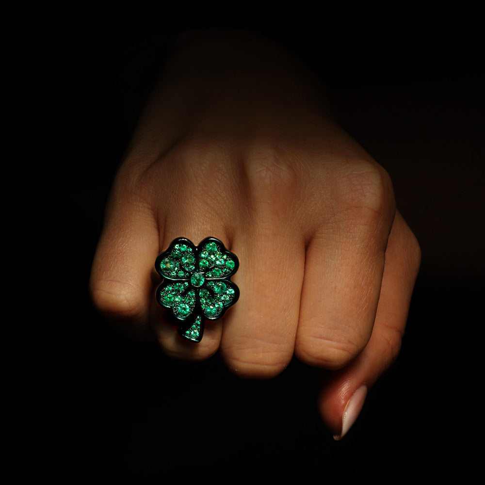 The Lucky ring by designer Solange Azagury-Partridge - Blackened 18k White Gold,, Ceramic and Enamel, Emeralds - on model hand