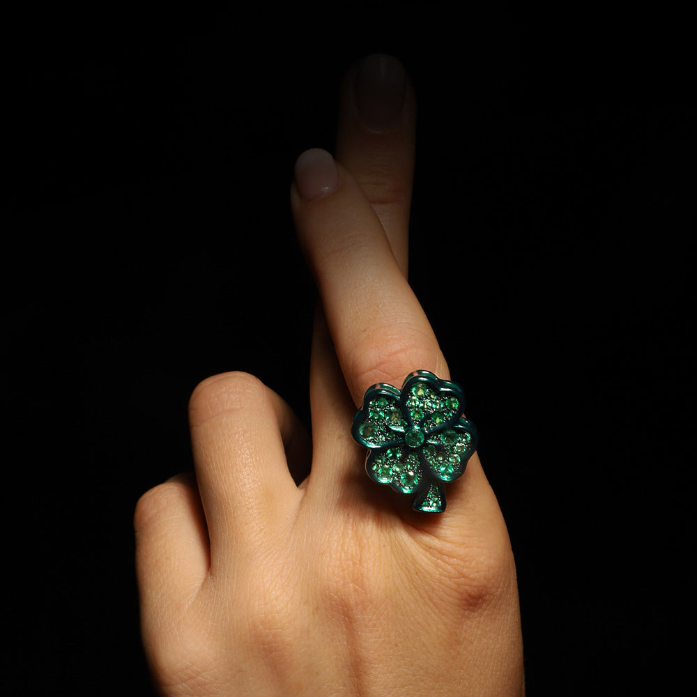 The Lucky ring by designer Solange Azagury-Partridge - Blackened 18k White Gold,, Ceramic and Enamel, Emeralds - on model hand 2
