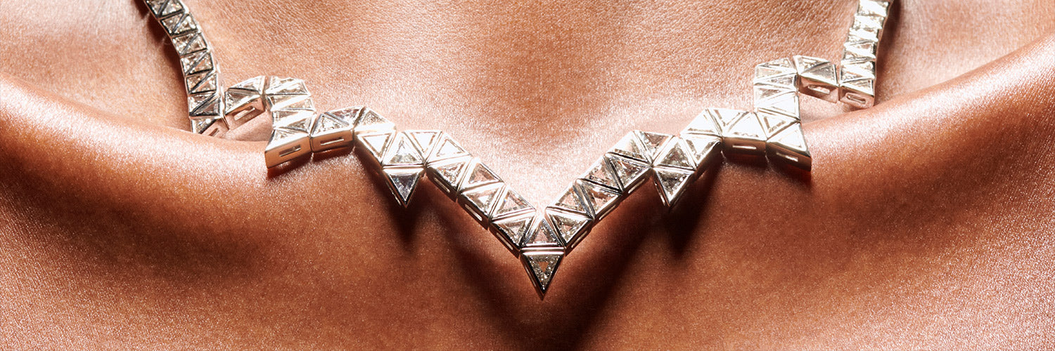 Triangle diamond and 18 karat white gold necklace on model by Solange Azagury-Partridge