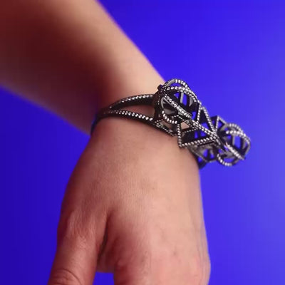 Platonic Cuff Made from Diamond Pave Encrusted Spheres, Cubes, and Triangles made from Diamonds and 18 karat White Gold By Solange Azagury-Partridge Video