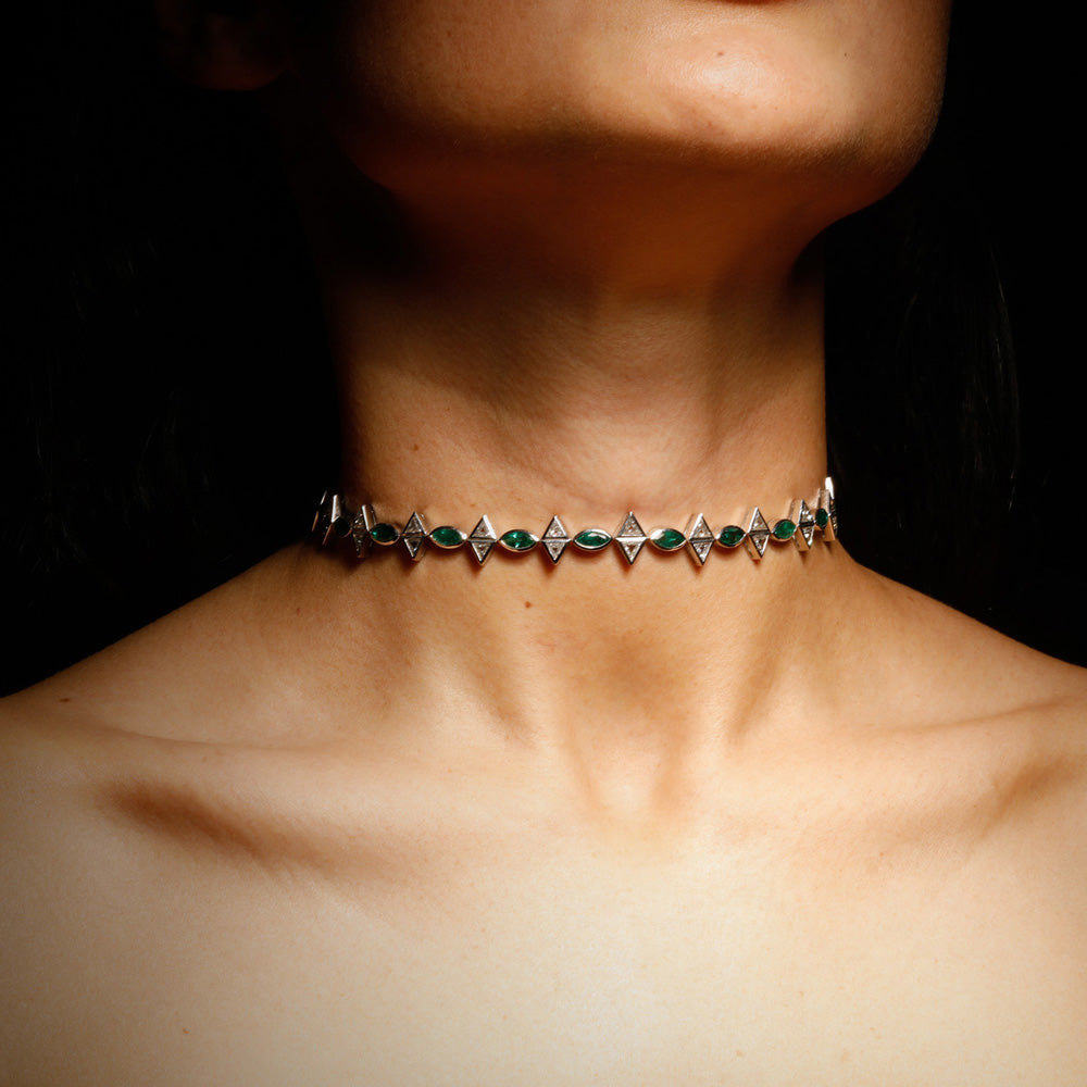 The Romantic Necklace by designer Solange Azagury-Partridge - Blackened 18 carat White Gold and Emeralds & Diamonds - front view on model