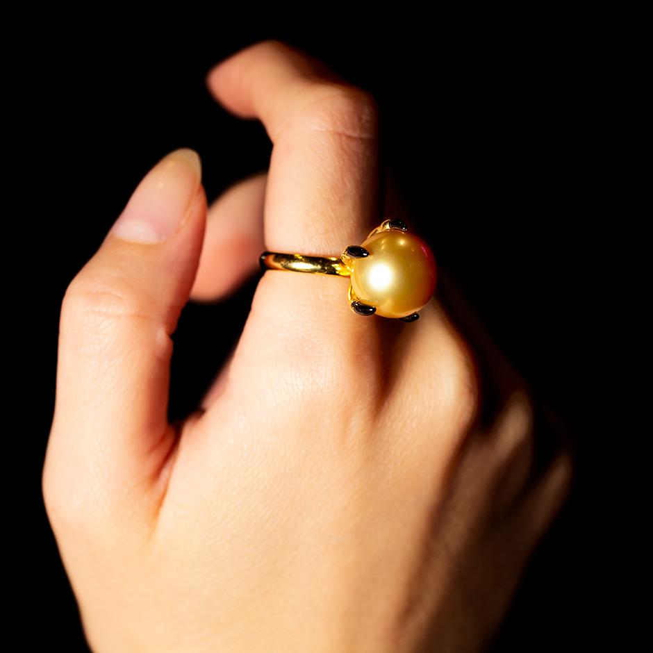 Ballcrusher Pearl Ring set in a 18 Karat Gold Birds Hand with Enameled Claws by British Designer Solange Azagury-Partridge on hand