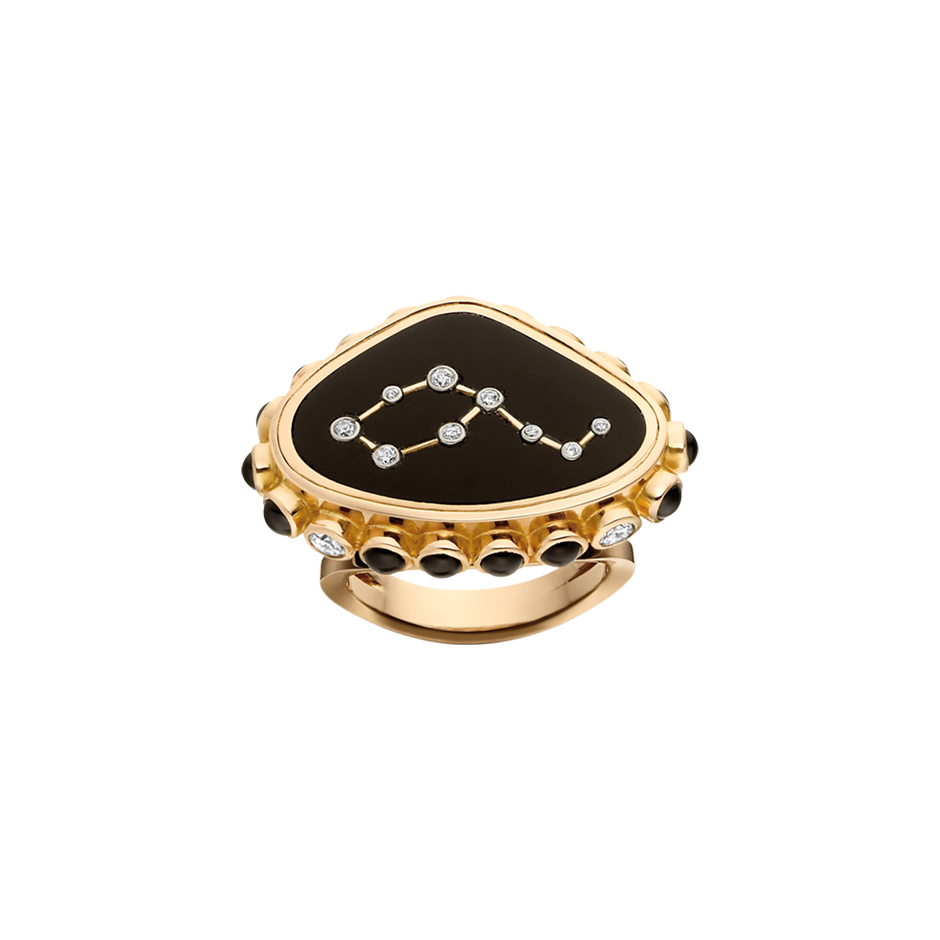 A plaque ring composed of a leo constellation shaped with diamonds set into black onyx with sapphires and diamonds around the edge in 18 karat yellow gold by Solange Azagury-Partridge.