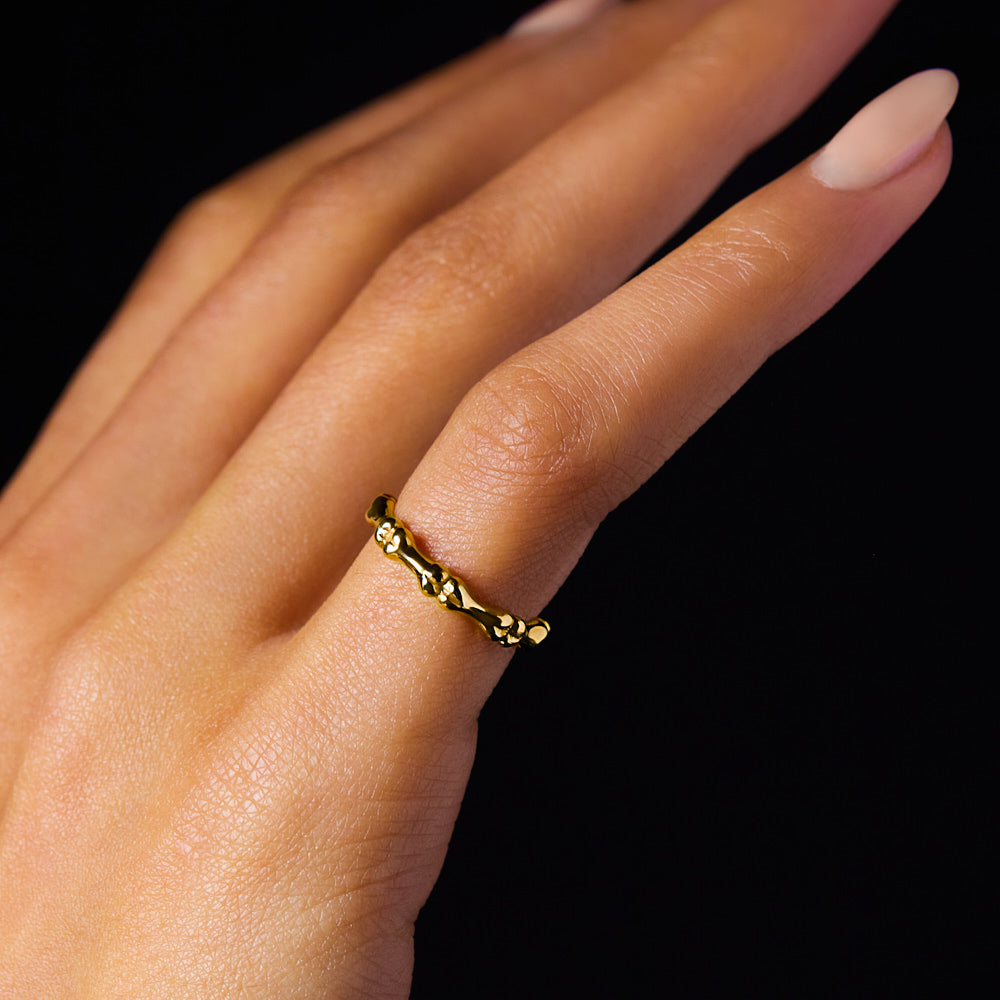 Bones Motif Wedding Band Ring made from 18 karat yellow gold by Solanage Azagury-Partridge on hand