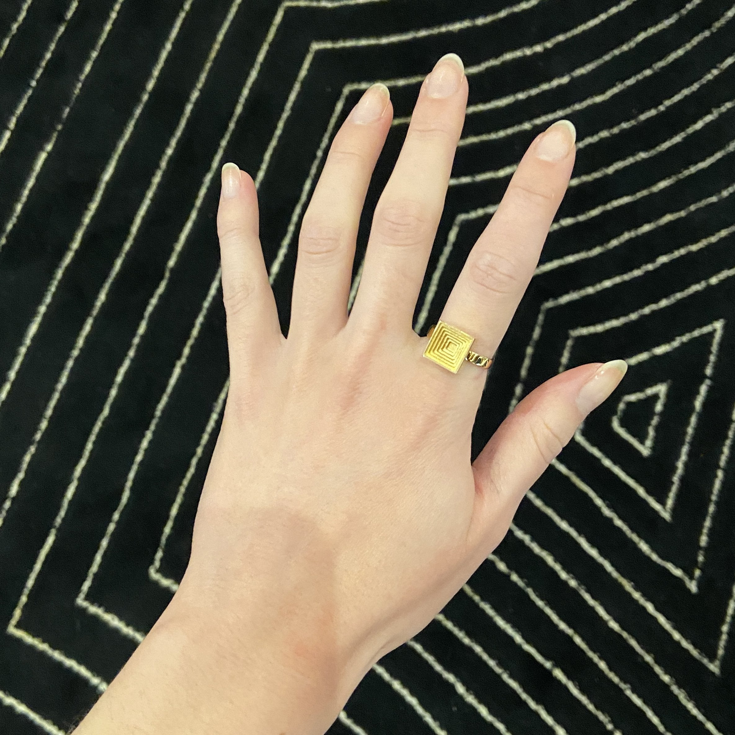 24:7 Square embossed Geometric Spinner Ring in 18 Karat Yellow Gold by Solange Azagury-Partridge on hand