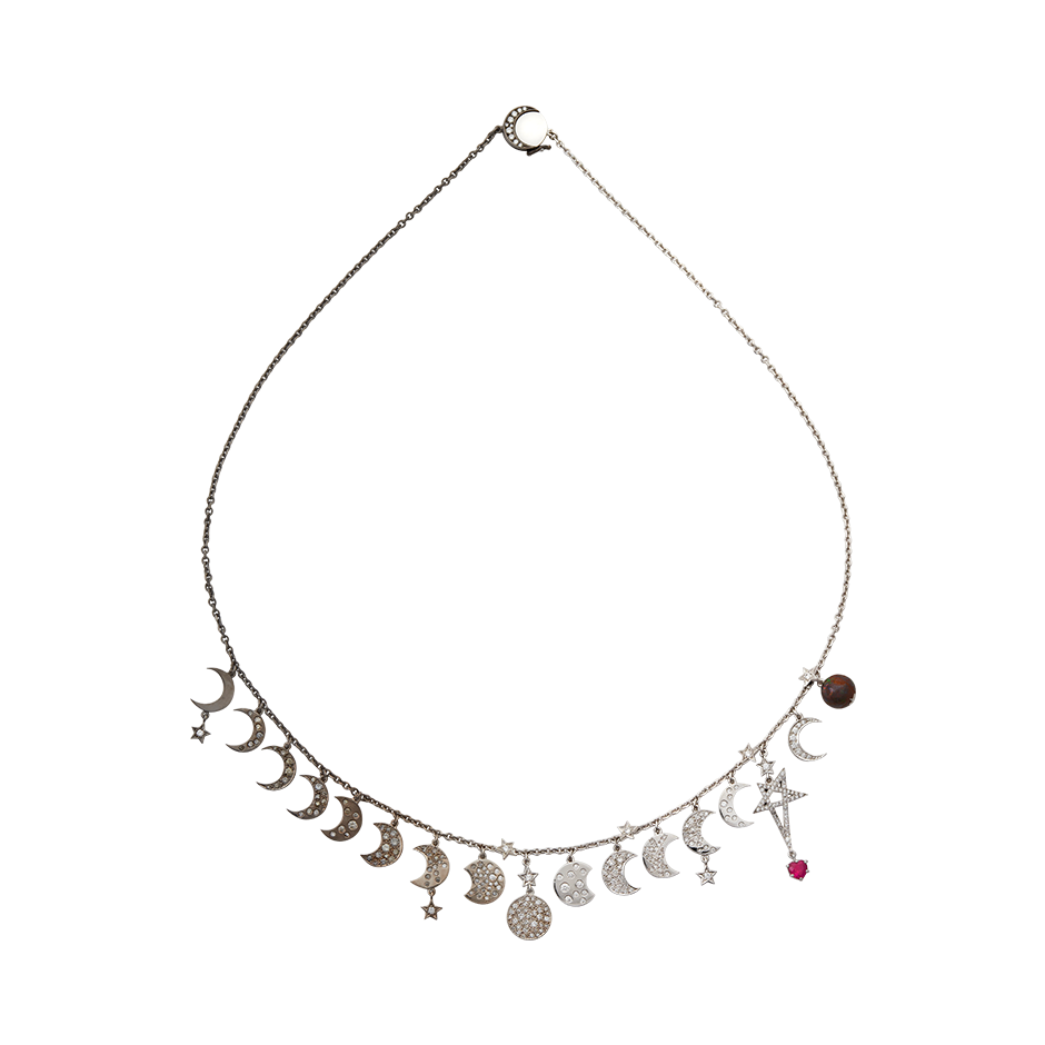 A moon and star motif necklace set with diamonds, a ruby heart and an opal world in blackened 18 karat white gold by Solange Azagury-Partridge