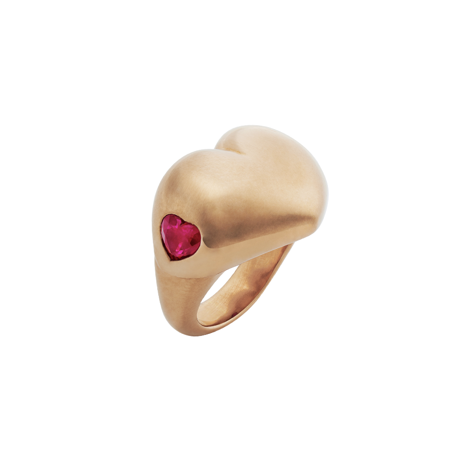 A love heart ring in 18 karat rose gold ring set with two heart shaped rubies on the side by Solange Azagury-Partridge