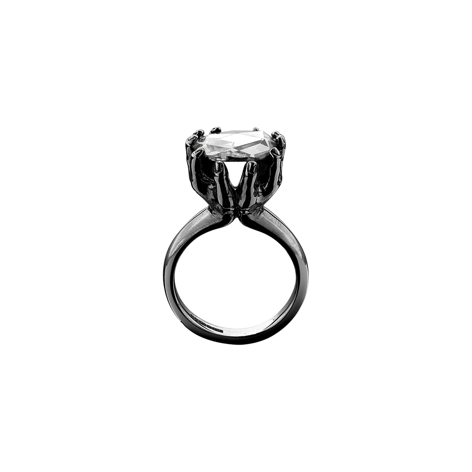 A rose cut diamond held by two outstretched hands ring in blackened 18 karat white gold by Solange Azagury-Partridge