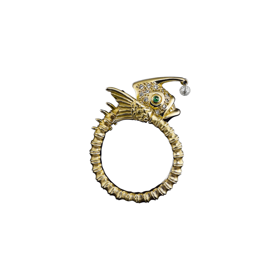 A zodiac skeleton pisces motif ring with diamonds, emerald eyes and a briolette diamond drops in 18 karat yellow gold﻿ by Solange Azagury-Partridge