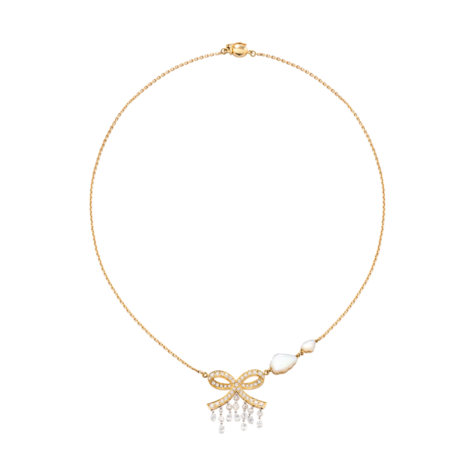 A necklace composed of a bow with diamonds, briolette diamonds drops and two mother of pearl cloud in 18 karat yellow gold  by Solange Azagury-Partridge