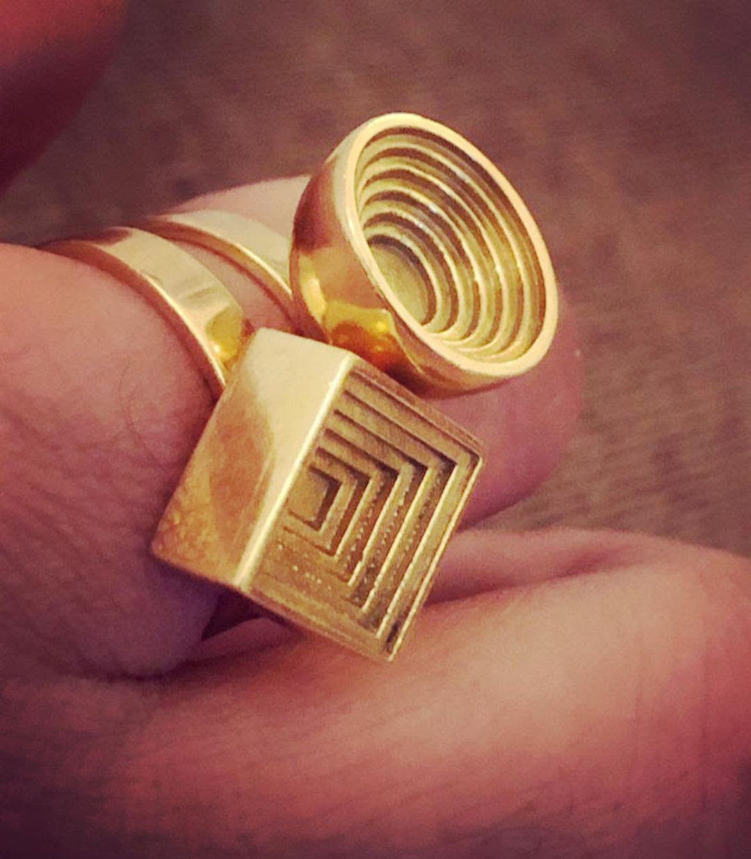 24:7 Square embossed Geometric Spinner Ring in 18 Karat Yellow Gold by Solange Azagury-Partridge on hand