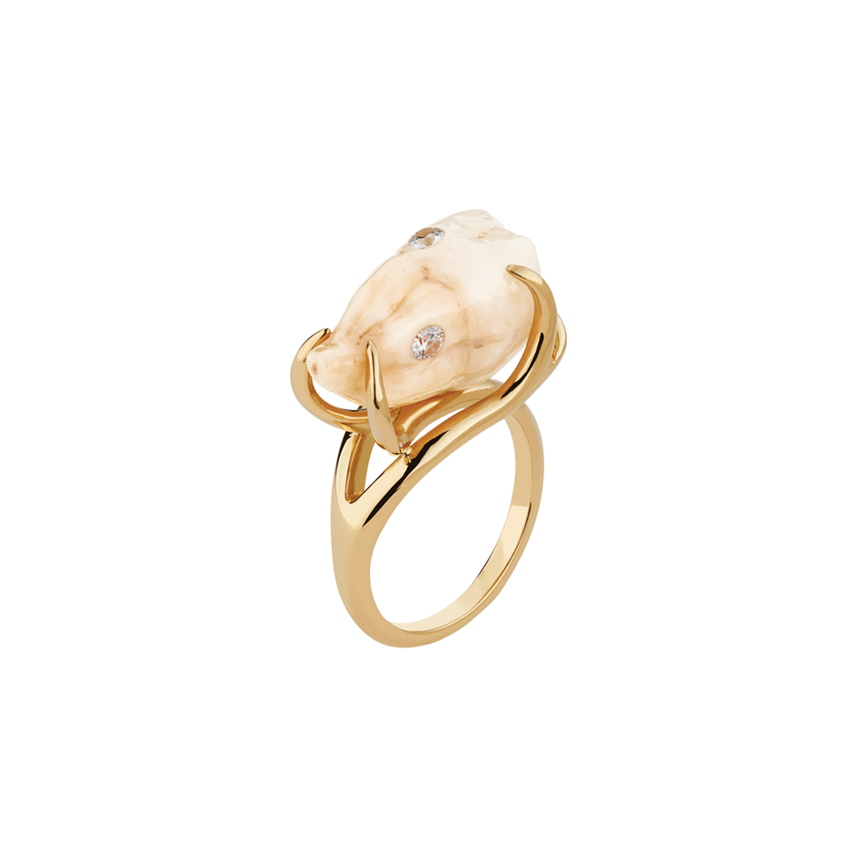 A ceramic wisdom tooth with two diamonds fillings set in 18 karat yellow gold by Solange Azagury-Partridge